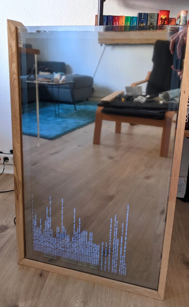 MagicMirror² running on a Pi Zero W on a mirror still in progress. You can see the boot up text